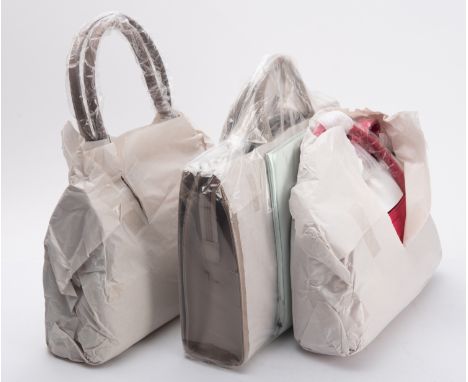 Radley. Three Radley handbags, including a Laurel Handle Briefcase in 'Mocha (suede)', together with two Cheadle bags in tan 