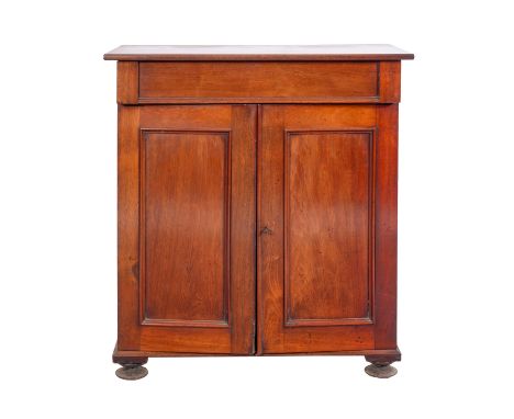A Victorian mahogany side cabinet, mid 19th Century; the rectangular top above a single drawer above two panel doors with bra
