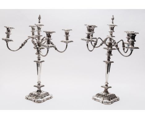 A pair of early 20th century silver plated four branch candelabra, unmarked, in the Rococo revival style, with applied foliat