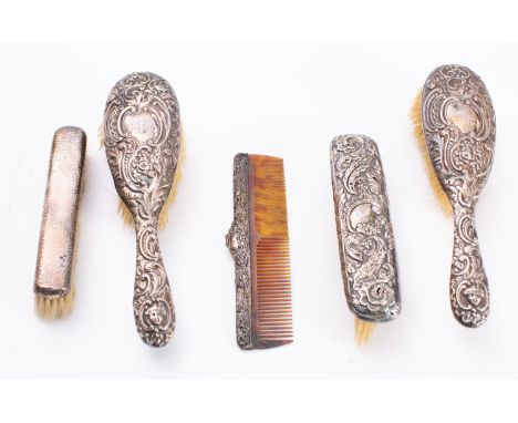 Four various silver backed brushes and a comb, various makers and dates (4) 

