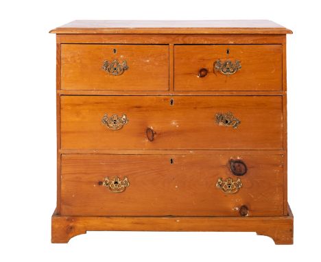 A Victorian Pine chest of drawers, late 19th Century; the rectangular top above two short and two long drawers all having bra