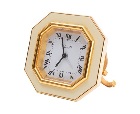 Cartier, Paris an octagonal brass and enamel desk clock the rear Cartier, Paris, 7507, 19655, Swiss Made, the gilded case wit