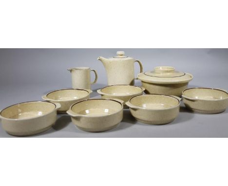A Poole oven proof part service, in spotted cream and brown decoration, comprising coffee pot, 19cm high, serving bowls, lidd