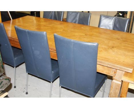 A light wood refectory style dining table, with rectangular overhanging top, raised on heavily tapering square supports, 80cm