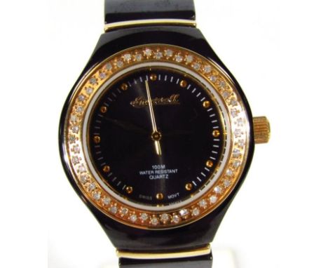 A ladies Ingersoll quartz wristwatch, diamond and ceramic model, set with small diamonds to the bezel, boxed with paperwork. 