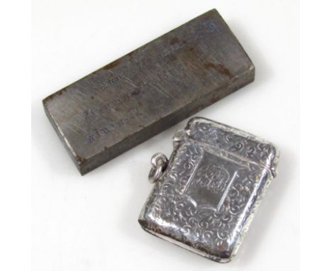 A Victorian silver vesta case, of rounded engine turned outline with ring side and plain interior, marks pitted, 5cm high, ½o