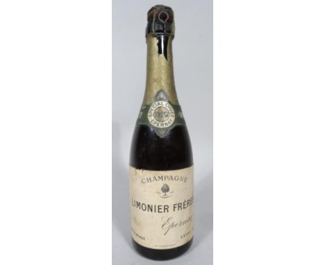 A 1926 vintage Limonier Freres Epernay half bottle of champagne, with 1926 foil label, unopened, 28cm high. 