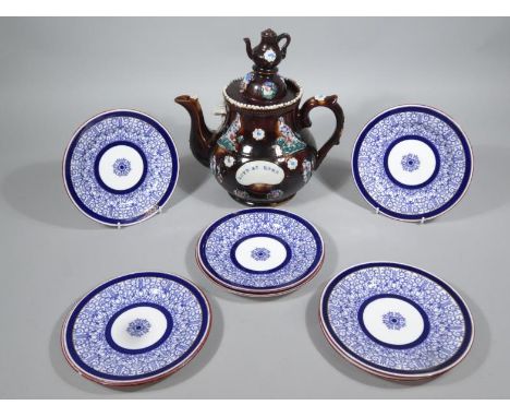 A 19thC style bargeware teapot, with teapot knop, domed cover and raised body with moulded handle and spout on circular foot,
