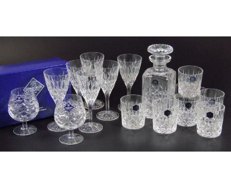 An Edinburgh Crystal drink set, to include decanter with compressed circular stopper 23cm high, whisky tumblers, wine glasses