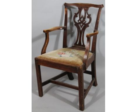 A George III mahogany dining chair, with pierced vase splat and tapestry drop in seat.