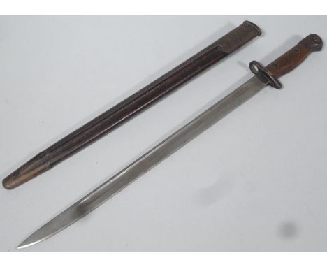 A 19th/early 20thC Wilkinson 190 bayonet, with part wooden and metal handle and scabbard, 59cm wide.