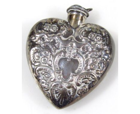 A silver heart shaped perfume bottle, with dabber stopper, screw top, engine turned with scrolls, on a vacant cartouche, 6cm 