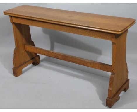 A light oak adjustable organist's bench.