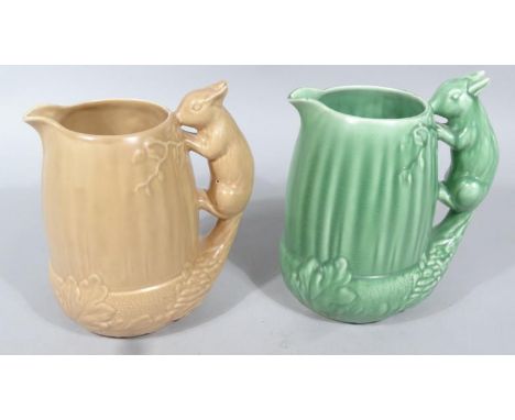 A Sylvac jug, in brown colour way, number 1959, with squirrel handle, another similar in green, 23cm high. (2)