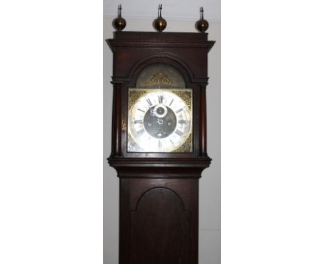 A George III oak longcase clock, with caddy top hood, ball and spike finials, the brass 30cm square arched dial having Royal 