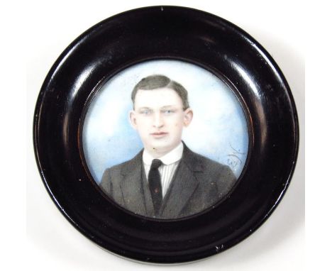 20thC English School. Portrait miniature, quarter profile of a gentleman, gouache, probably ivory, initialled E W, 8cm x 7cm.