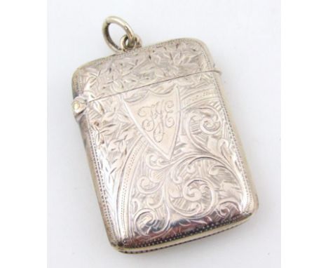 A late Victorian silver vesta case, partially engine turned with initialled cartouche, plain interior, and hook top, with mat