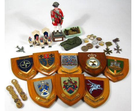 Various militaria, to include army board shields for NATO, etc. on pine backs, 18cm high, two sentry figures, rope twist epau