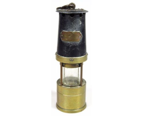 A mid 20thC Naylor Limited Wigan miner's lamp, of cylindrical outline with glass centre and 'S' hook top, 30cm high.