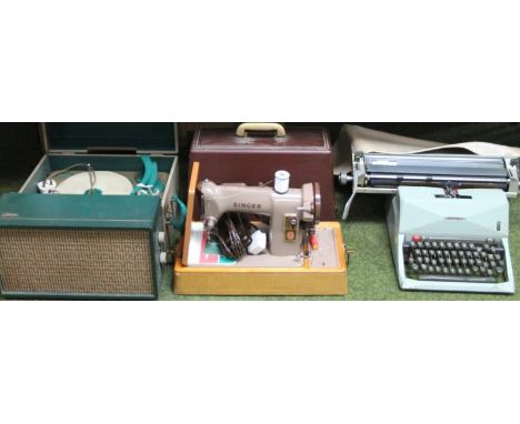 A bygone Webb record player, with turntable and turquoise arm, with front speaker, cased, 41cm wide, a Singer leather sewing 