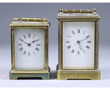 A Late 19th/Early 20th Century Carriage Clock and a Carriage Timepiece, the clock with white enamel dial with Roman numerals,