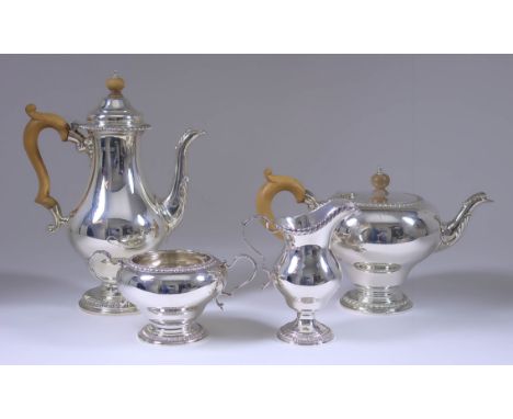 An Elizabeth II Silver Baluster Shaped Four-Piece Tea and Coffee Service, by William Comyns &amp; Sons, London 1963, with gad