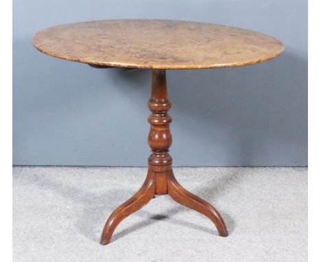 An 18th Century Burr Elm Circular Tripod Table, the burr elm veneer top on turned central column and splayed supports, 35ins 