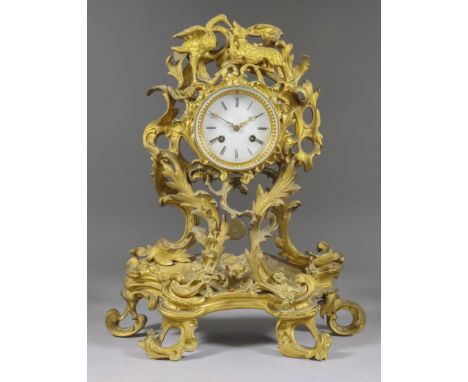 A Mid 19th Century French Gilt Brass Cased Mantel Clock of "Louis XV" Design, the 3.5ins diameter white enamel dial with Roma