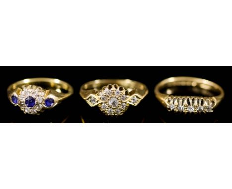 A Sapphire and Diamond Ring, Modern, and Two Other Rings, all in 18ct gold mounts, the sapphire and diamond ring set with cen