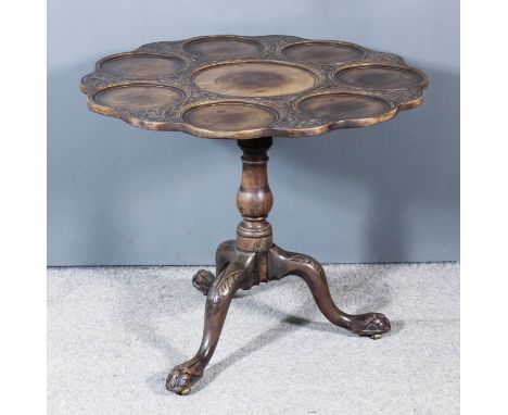 A Mahogany Circular Tripod Supper Table of "George II" Design, the tray top centre surrounded by seven smaller circular tray 