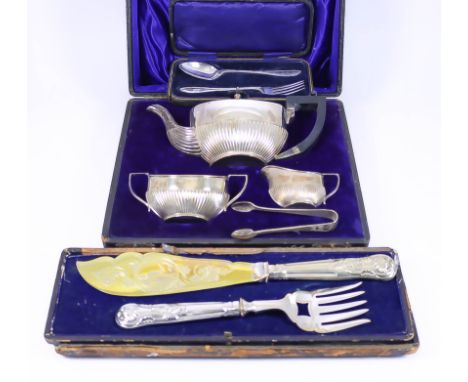 A Bachelor's Three-Piece Tea Service, the oval bodies partly reeded, comprising - a plated tea pot, a George V silver two-han