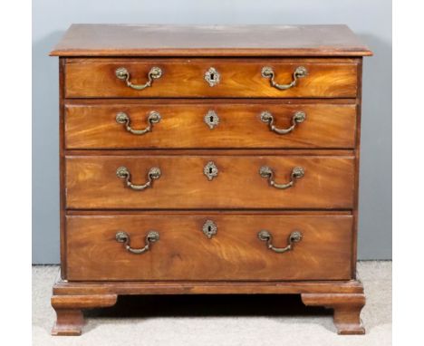 A George III Mahogany Chest, with moulded edge to top, fitted four long graduated drawers with later cast brass shaped moulde