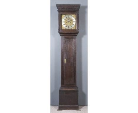 An 18th Century Oak Longcase Clock, by John Bird of Seagrove, the 12ins square brass dial with wide silvered chapter ring wit