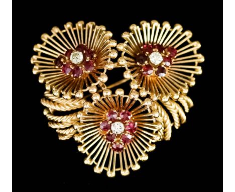 An 18ct Gold Diamond and Ruby Brooch, Modern, of triple flowerhead pattern, set with three small diamonds, approximate total 