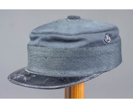 A Warrant Officer's Undress Cap with Black Pearl Buttoned Crown, pre-WWI, with miniature bugle horns to sides, replacement ch