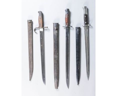 A Japanese second World War Bayonet, 16ins bright steel fullered blade, marked with triple circle motif, hardwood grips, and 
