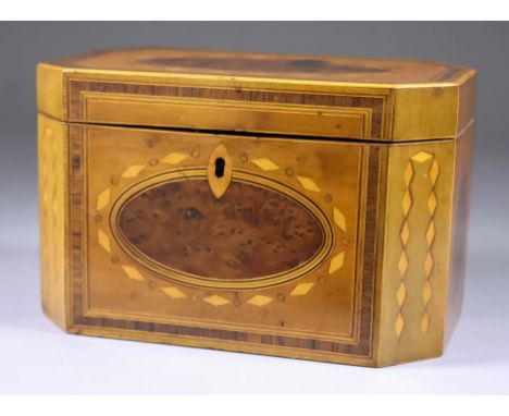 A George III Satinwood Octagonal Tea Caddy, inlaid with oval burr yew panels within patterned borders, 8.25ins wide x 4.75ins