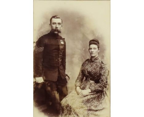 A Photograph of a Lance Sergeant, Rifle Brigade, and his Wife, Afghan War and Long Service Good Conduct Medals, with crossed 