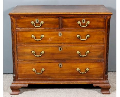 A George III Mahogany Chest, with moulded edge to top, fitted two short and three long drawers with later gilt brass and moul