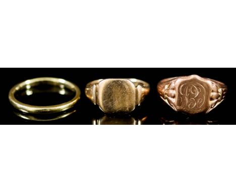Three 9ct Gold Rings, two signet rings, one with engraved face, sizes N and R, the wedding band size R, total gross weight 11