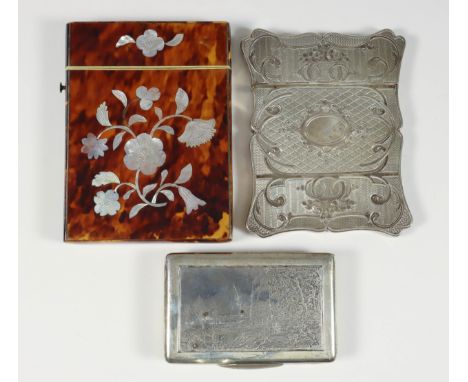 A 19th Century French Silver Rectangular Card Case, of shaped outline engraved with oval cartouche, floral, scroll and engine