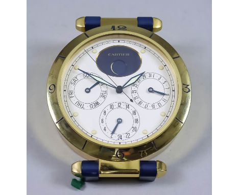 A Modern Cartier Lacquered Brass Desk Clock, No. 00395, the cream dial with raised hour button and with full calendar and moo