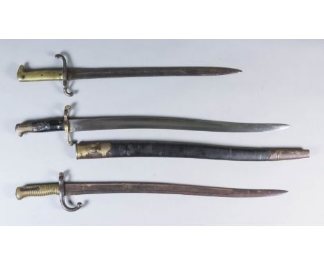 A 19th Century Yucatan Sword Bayonet, 23ins fullered bright steel blade, conforming black leather and brass scabbard, 29ins o
