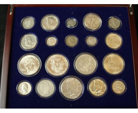 A cased set commemorating a Century of U.S. silver coinsTo include Morgan dollars dated 1921, further dollars, half dollars, 