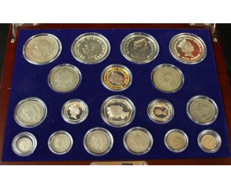 'The House of Windsor Silver Coin Collection'Housed in a glazed case, the lift up lid to reveal George V crown dated 1935, Ge