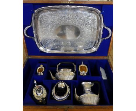 An impressive Victorian matched silver four-piece tea and coffee service, with spirit kettle and two-handled trayThe service 