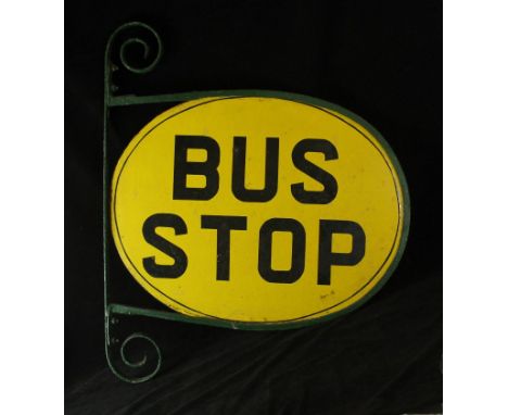 An original British Transport enamel sign'Bus Stop' on a yellow ground, inset within metal frame, sign measurement 46x60cm 