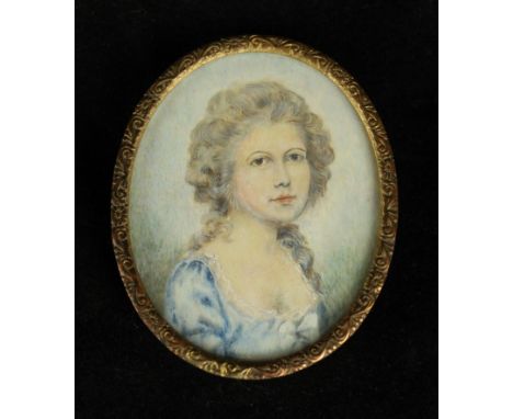 An early 20th Century portrait miniatureDepicting a lady wearing a blue dress, inset within gilt frame, 6x5cm