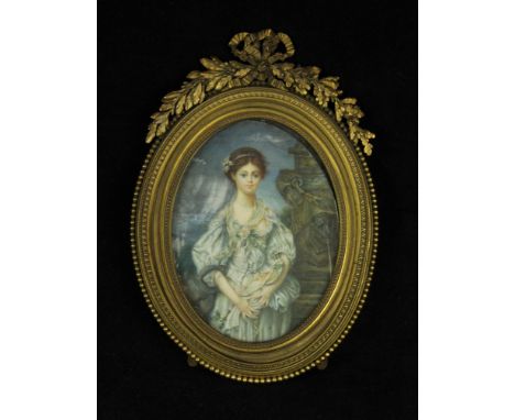 An early 20th Century portrait miniatureDepicting a girl wearing Victorian clothing in landscape scene, inset within gilt met