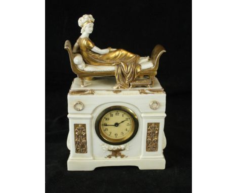 An early 20th Century Continental porcelain mantle clock, by A W F Kister ScheibeThe clock surmounted by a lady in gilt dress